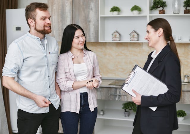 a property manager meeting with two clients